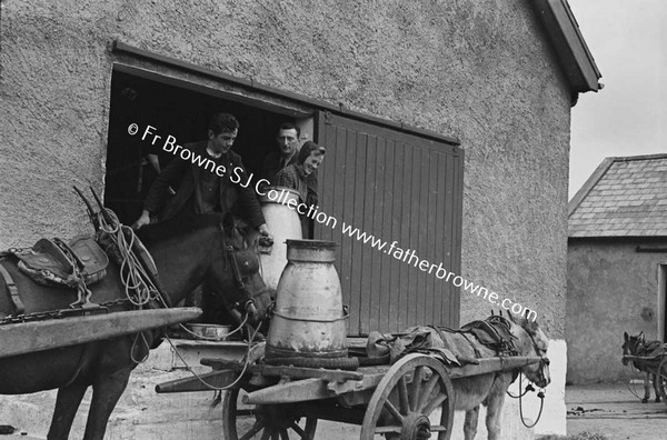 COORACLARE CREAMERY  REPLCING EMPTY CHURNS ONTO CART